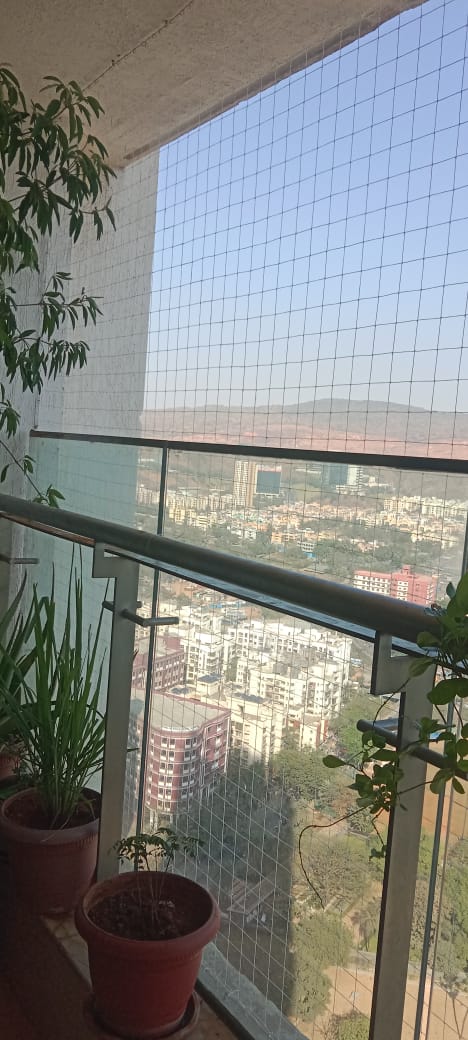 Balcony bird netting with city view